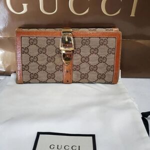 Gucci GG Logo Continental Canvas Tan Bifold Wallet with Leather Trim. 1462012778